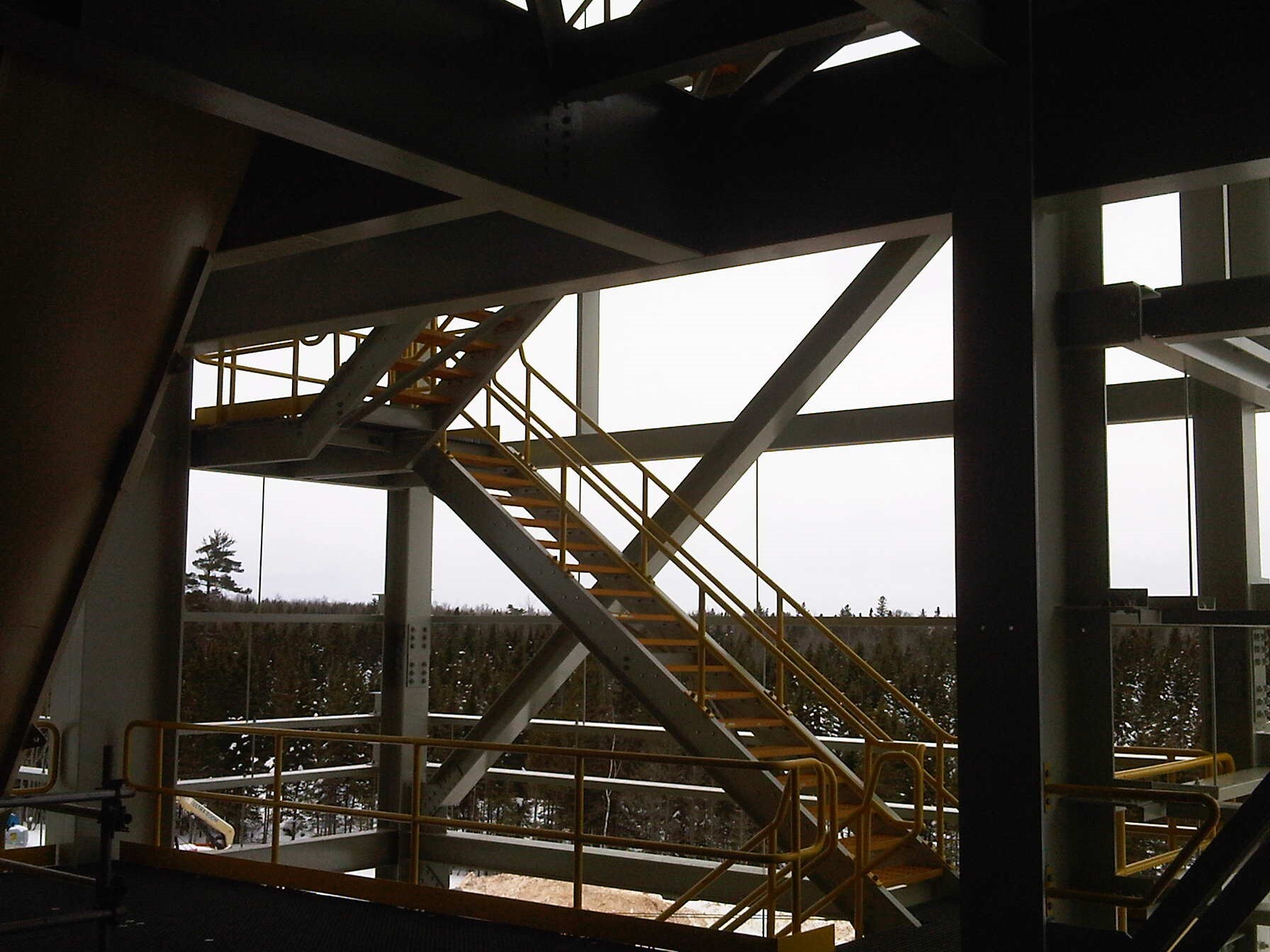 Non-slip FRP stairs and safety railing in a mining facility