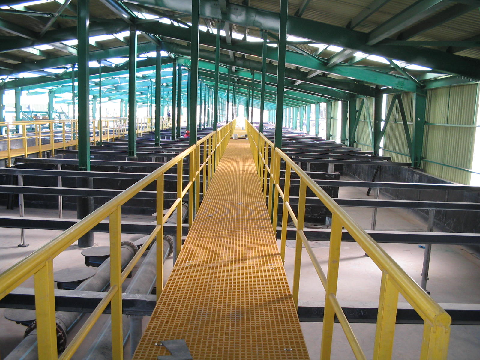 FRP walkway made with yellow molded grating ensuring mining safety compliance
