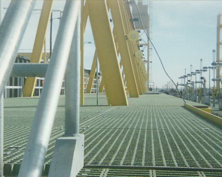 Green molded grating at a railroad freight yard